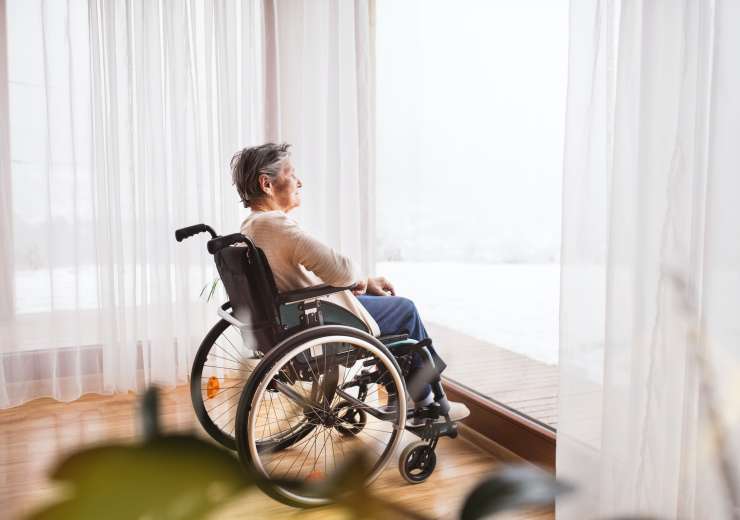 Senior woman in wheelchair at home.